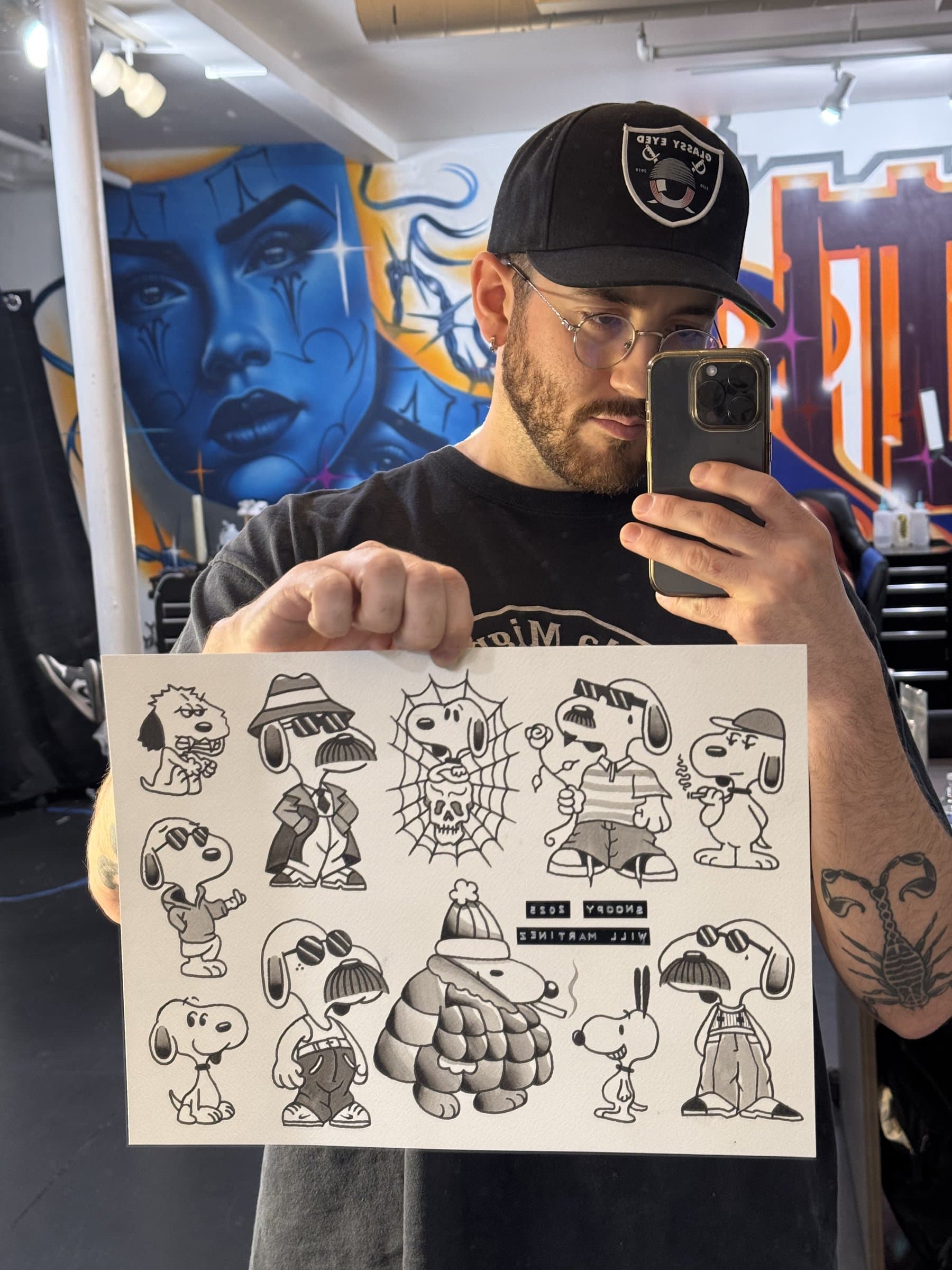 Black and grey illustrative manga-inspired arm tattoo